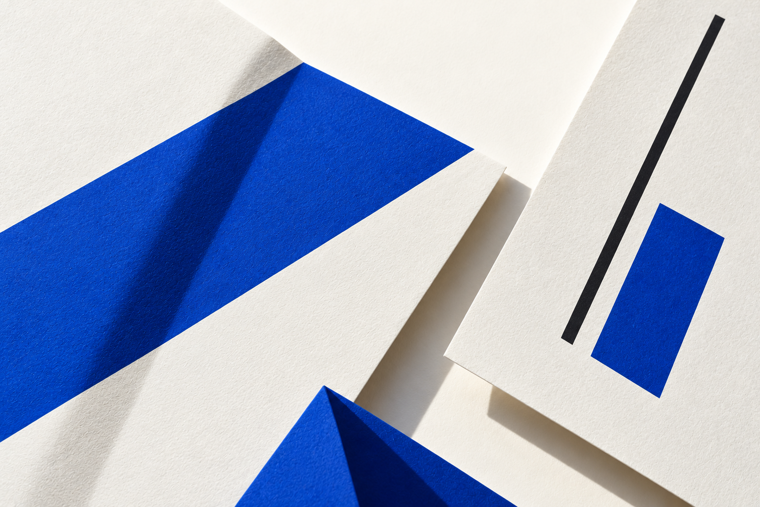 Concept study of blue graphic forms, paper and a fine black line.
